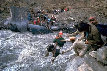 Crossing the Ghuzherav River at War-e-Ben, Shimshal, 1991